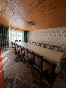 a conference room with a long table and chairs at Village stay in Kaindy