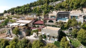 an aerial view of a house in a mountain at Casadar Guesthouse in Ash Shi‘b