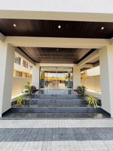 a lobby of a building with blue steps at Hotel Sai Mahima, Near Sai Baba Temple in Shirdi