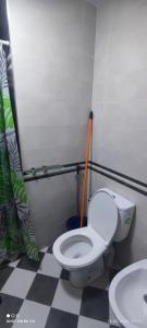a bathroom with a toilet and a sink at Isco Stam in Martil