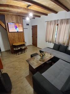 a living room with a couch and a table at Kuća za odmor Buk in Čapljina