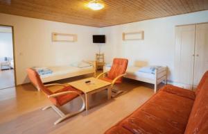 a living room with a couch and a table at Penzion u Valešů in Mohelno