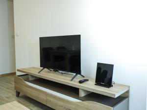 a flat screen tv sitting on top of a table at Nada Apartman in Prijedor