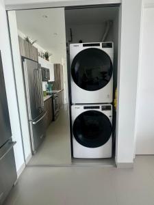 a washer and dryer in a kitchen at Ben's Gem in Philipsburg