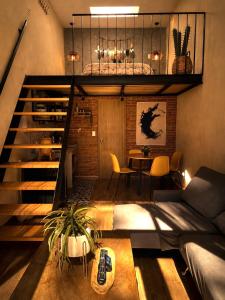 a living room with a staircase and a couch at Cabañas Boutiques TinyChillHouse in Mineral del Chico +43 photos