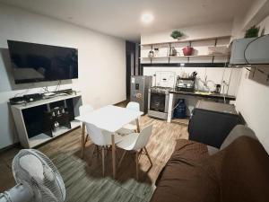 a living room with a couch and a table at Comodidad en un solo lugar in Lima