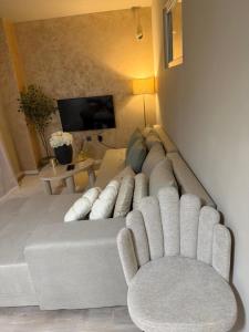 a living room with a couch and a chair at Rosabell in Imotski