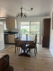 a dining room table and chairs in a kitchen at Safehaven in Avon Park