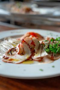 a plate of food with shrimp on a table at Albergo Conca D'Oro in Foggia