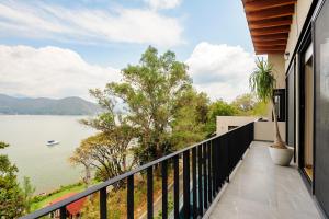 a balcony with a view of a lake at Villa del Carmen in Colorines