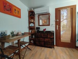 a room with a table and a mirror on the wall at Soucado in Fréjus