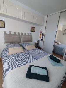 a bedroom with two beds with towels on them at Soucado in Fréjus +39 photos
