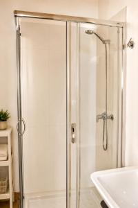 a shower with a glass door in a bathroom at Casa Luenga in Vinuesa +74 photos