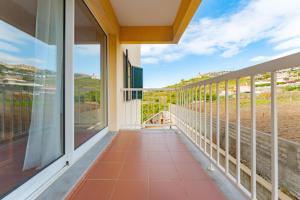 a balcony with a view of the ocean at One-Bedroom Apartment near Reis Magos Beach in Caniço