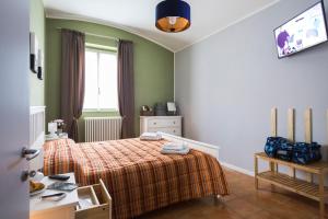 Un pat sau paturi într-o cameră la Polvara Trentuno Accommodations