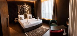 a bedroom with a bed and a table and a chair at Forest Grandeur Resort in Anantnāg