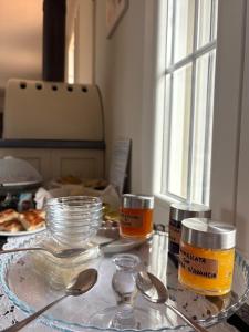 a table with a plate of food and spoons at Il Sogno di Tebà in Fubine
