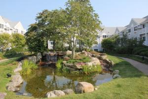 a pond in the yard of a home at Two Trees Inn in Ledyard Center