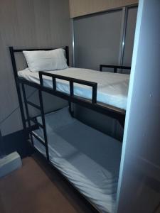 a couple of bunk beds in a room at AC Dormitory in Varanasi