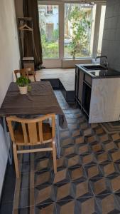 a kitchen with a table and a stove at Fachwerk Studio in Leipzig