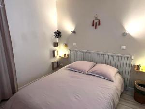 a bedroom with a white bed with two pillows at Blue Lagoon in Six-Fours-les-Plages +52 photos