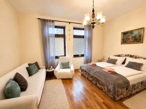 a living room with two beds and a couch at Ljubez Apartment in Jajce