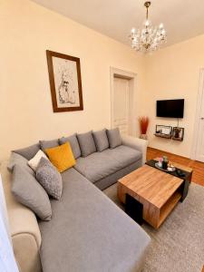 a living room with a couch and a coffee table at Ljubez Apartment in Jajce