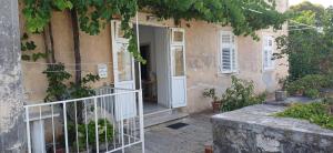 an entrance to a house with a white door at Apartment Mia in Dubrovnik