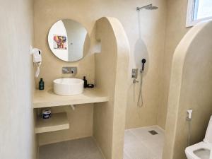 a bathroom with a sink and a shower at ROHO-Residence in Nungwi +52 photos