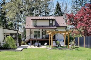 a house with a gazebo and chairs in the yard at Cozy Home Retreat by the River in Cressona