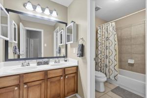 a bathroom with a sink and a toilet at Spacious 5-BD 3-BA Forest View Getaway Sleeps 13 in Dallas +36 photos