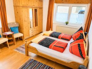 a bedroom with a bed with two pillows on it at Käthe's Gästezimmer in Reimerath