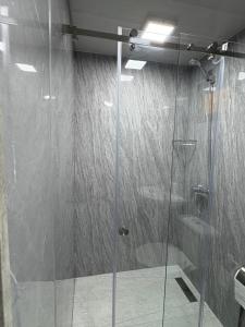 a shower with a glass door in a bathroom at Old Byurakan Cottage in Byurakan +74 photos