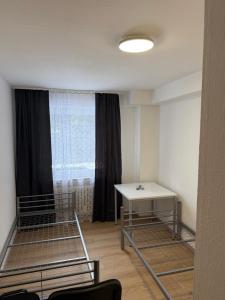 a room with two bunk beds and a window at Monteurhome Monteurzimmer A7 A5 in Niederaula