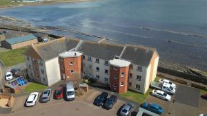 an aerial view of a building next to the ocean at Sea Point - 2 bed apartment in Saltcoats