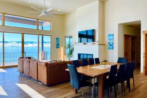 a living room with a table and a couch at Beach Front Haven in Laketown
