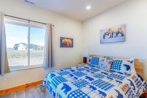 a bedroom with a bed and a window at Beach Front Haven in Laketown