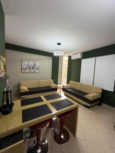a living room with a table and a couch at Seaside Family Escape in Golem