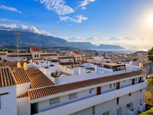 a view of a city from a building at Penthouse with Sea and Mountain view by NRAS in Altea +14 photos