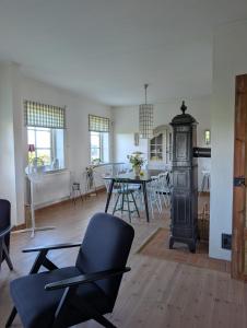 a living room with a table and a dining room at Villa Valdemar in Hammenhög
