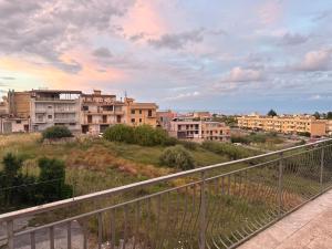 a view of a city with buildings on a hill at Casa Vacanza Colletta - appartamenti e lido in Casteldaccia