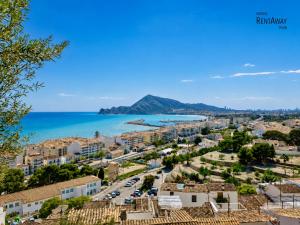 a view of a town with the ocean in the background at Penthouse with Sea and Mountain view by NRAS in Altea