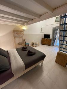 a bedroom with a large bed in a room at Résidence Le Golfe Bleu in Rayol-Canadel-sur-Mer +65 photos