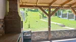 a view of a garden from the inside of a house at Iosif 55 in Sighişoara +45 photos