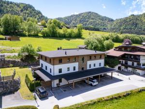 an aerial view of a house with a yard at Haus Steinplatte in Waidring