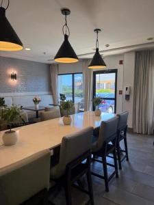 a dining room with a large table and chairs at Hampton Inn Conyers in Conyers
