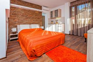 Postel nebo postele na pokoji v ubytování Apartments Figarola