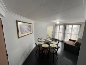 a living room with a table and chairs and a couch at Corro 8 in Córdoba