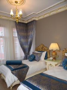 En eller flere senger på et rom på İstasyon Hotel