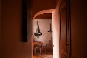 a hallway with a room with a table and chairs at Nida Center Studio Apartment in Neringa